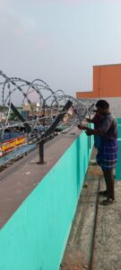 Razor wire fencing on a compound wall in Chennai
