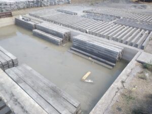 Precast compound wall slabs curing in water
