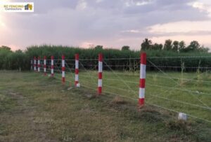 Red and white post fencing for agricultural land, Chennai