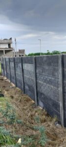 Grey precast compound wall along a plot in Chennai