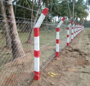 Chain link fence with red and white posts